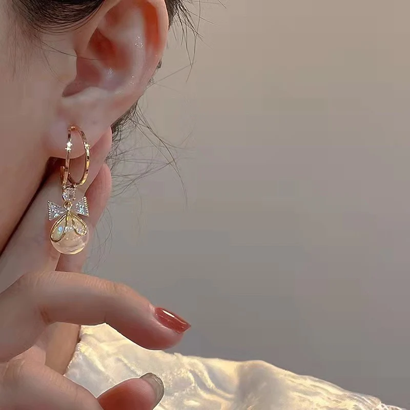 Elegant Pearl Bow Dangle Earrings - Image 3